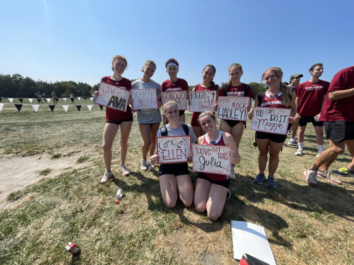 Cross Country showed up to the meet with signs for their teammates.