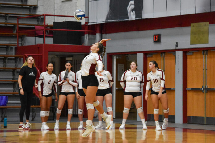 Esmae Oehler '25 serves at the Muhlenberg volleyball season opener against Franklin & Marshall on Sept. 28. Photo by Photo Editor Kira Bretsky '27.