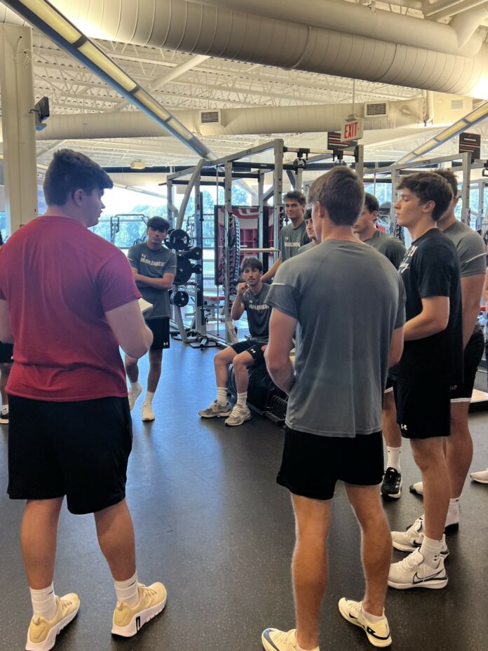 Strength and Conditioning coach Garrett Thomas works with the men's soccer team. Photo by Evan Schlotterbeck '25.